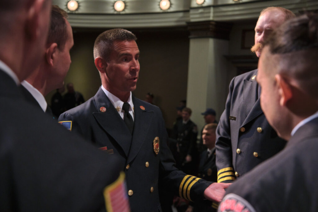 Goshen Firefighters chat after a Recruit Academy graduation ceremony held on Wednesday, April 2, 2025 at the Goshen Theater. (Photo credit: James Korn | Eyedart)