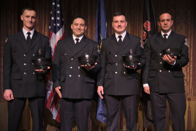 Goshen Fire Department Recruit Academy graduates Charles Holderbaum, Brian Guerra, Jeffery Gill and Ryan Rentfrom pose after a ceremony on Wednesday, April 2, 2025 at the Goshen Theater. (Photo credit: James Korn | Eyedart)